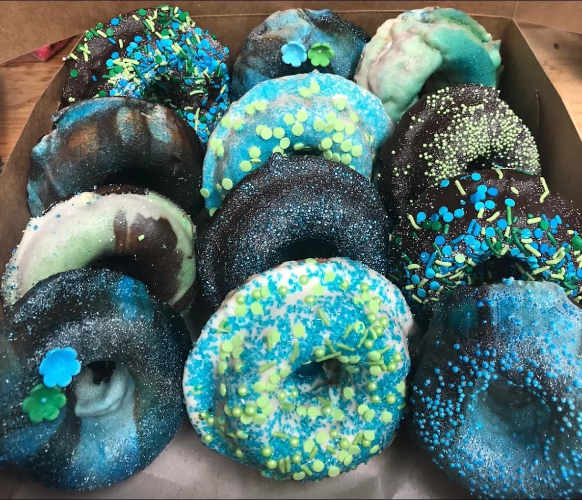 Blue and teal glittered donuts with green sprinkles